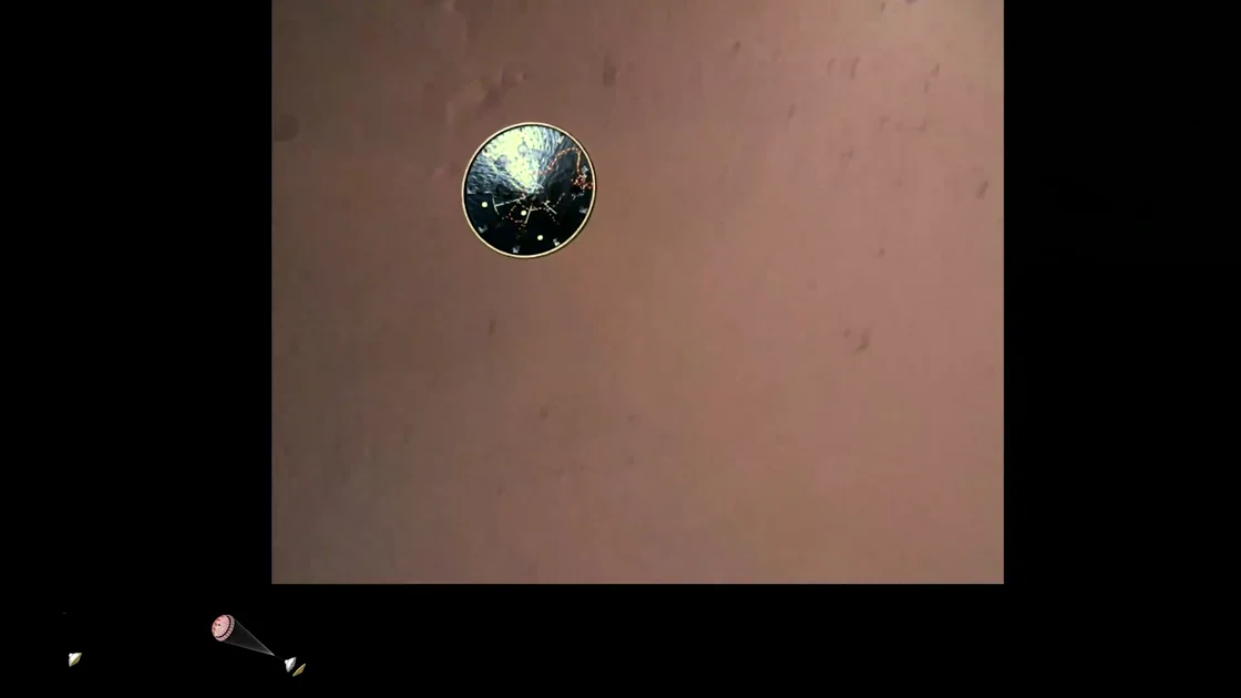 Detached heat shield falling toward the Martian surface at 00:35